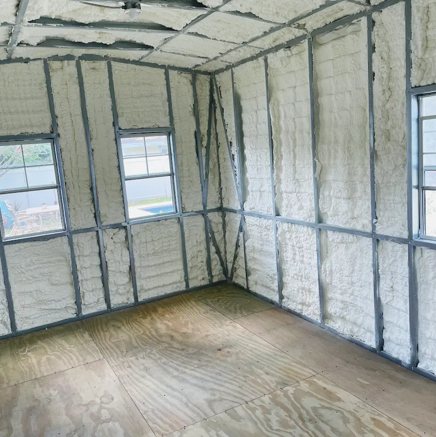 Closed-cell spray foam insulation applied to wall cavities in a residential project in Keene